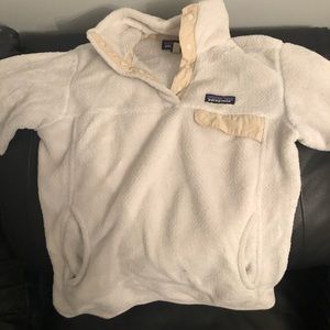 Small cream colored women’s Patagonia sweatshirt